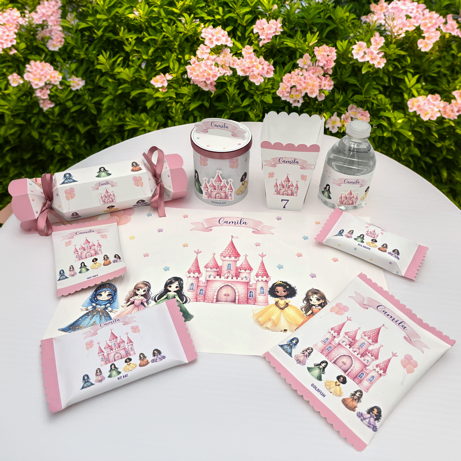 An enchanting Princess-themed birthday party display featuring matching placemats, candy tubes, popcorn tubs, water bottle labels, snack labels, and a decorated Pringles can for a magical celebration.